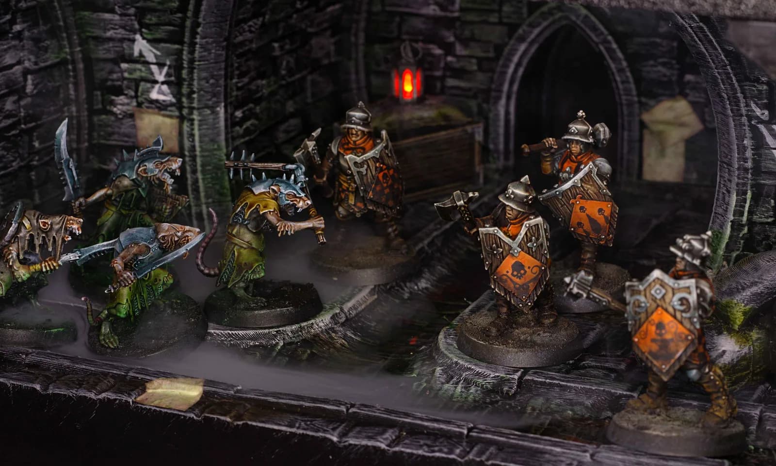Arche en pierre et affrontement de figurines sur décor Mordheim